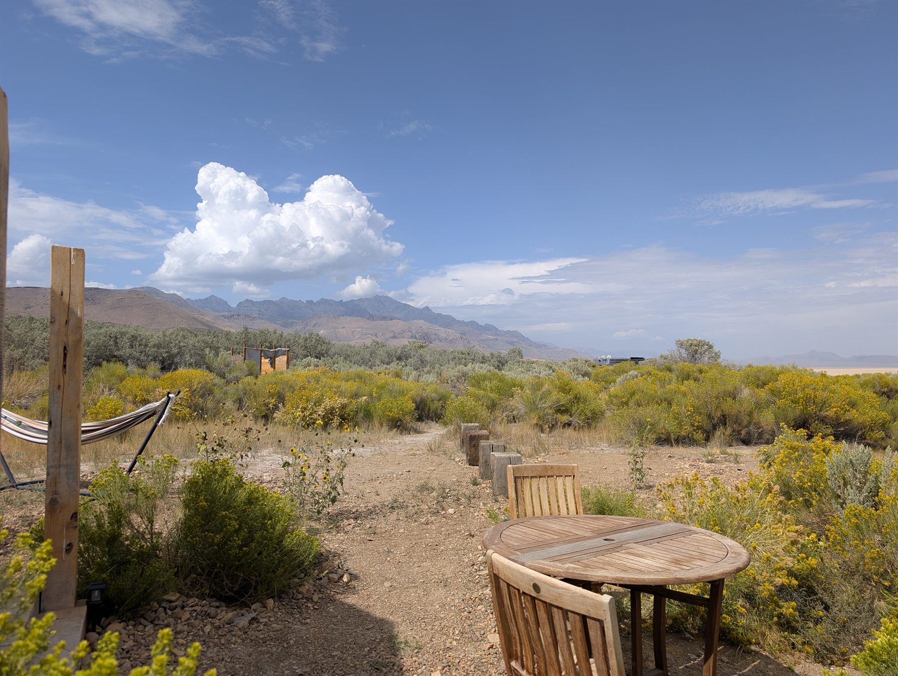 The high desert and distant mountains that form the cabin's front yard
