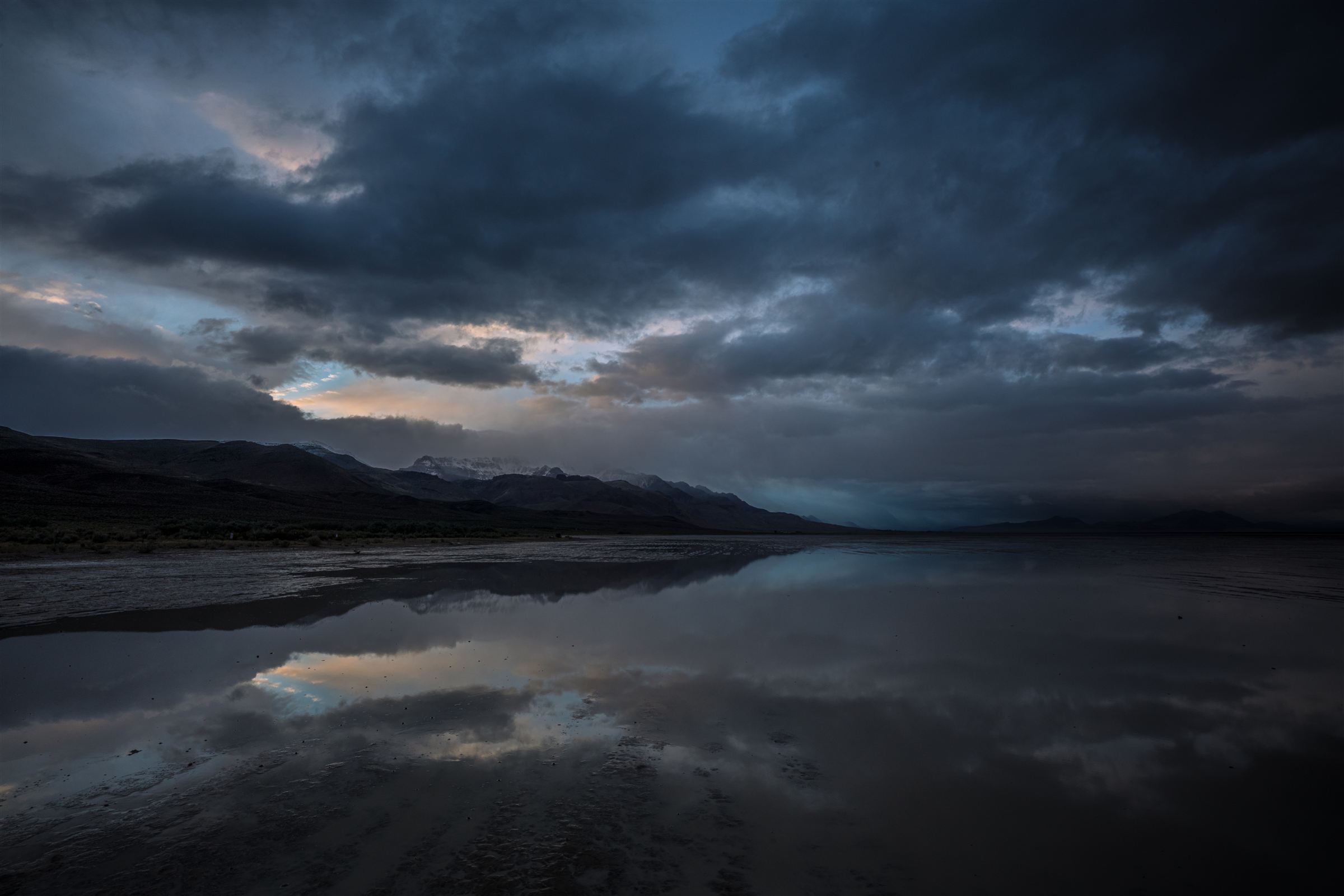 Steens Mountain reflected in the wet playa